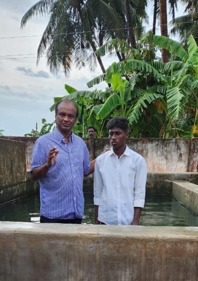 India Trip - Edwin is conducting a water baptism