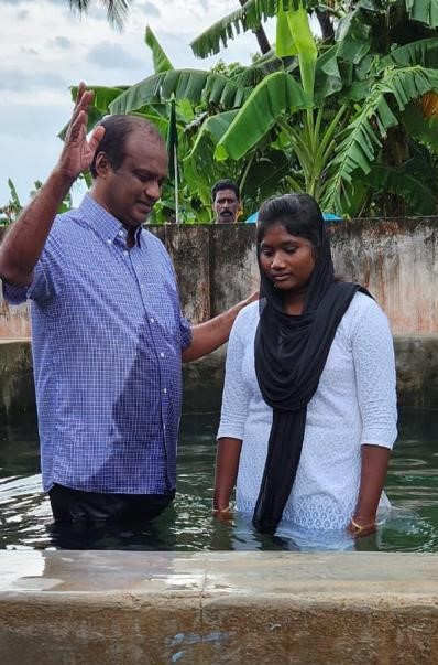 India Trip - Edwin is conducting a water baptism