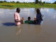 Bishop Francis conduct water Baptism at Uganda