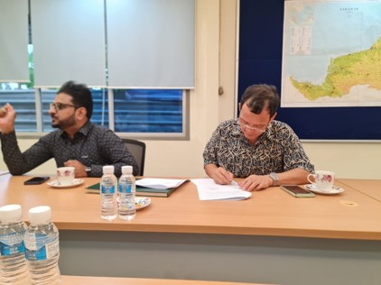 Pastor Tram signed as witness - MOU Signing