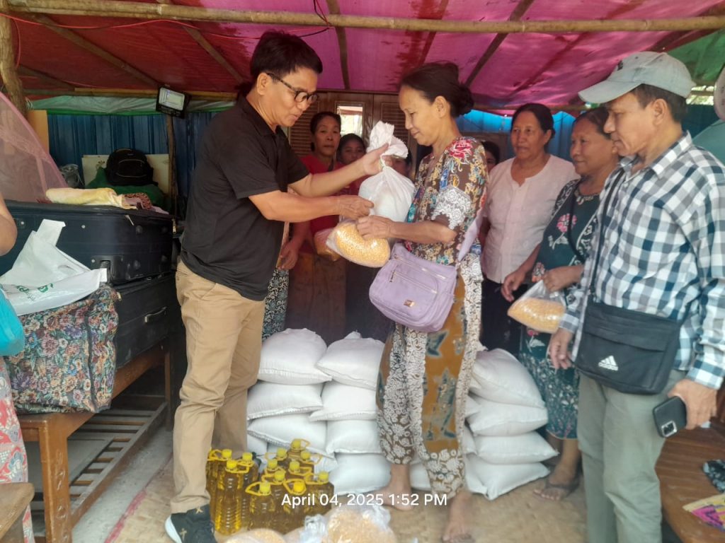 Handing out groceries to victims