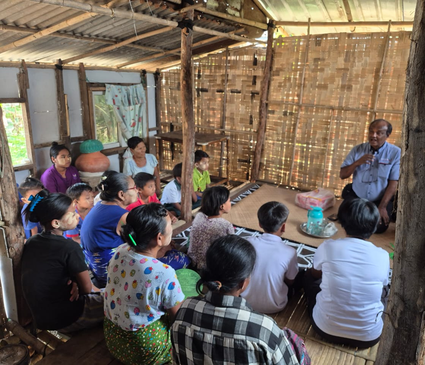 Sharing the Word in the hut church in Ta Gwen Deng village