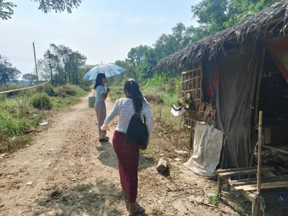 Sister Thian Thain and Sister Wai Wai Nu doing door to door ministry